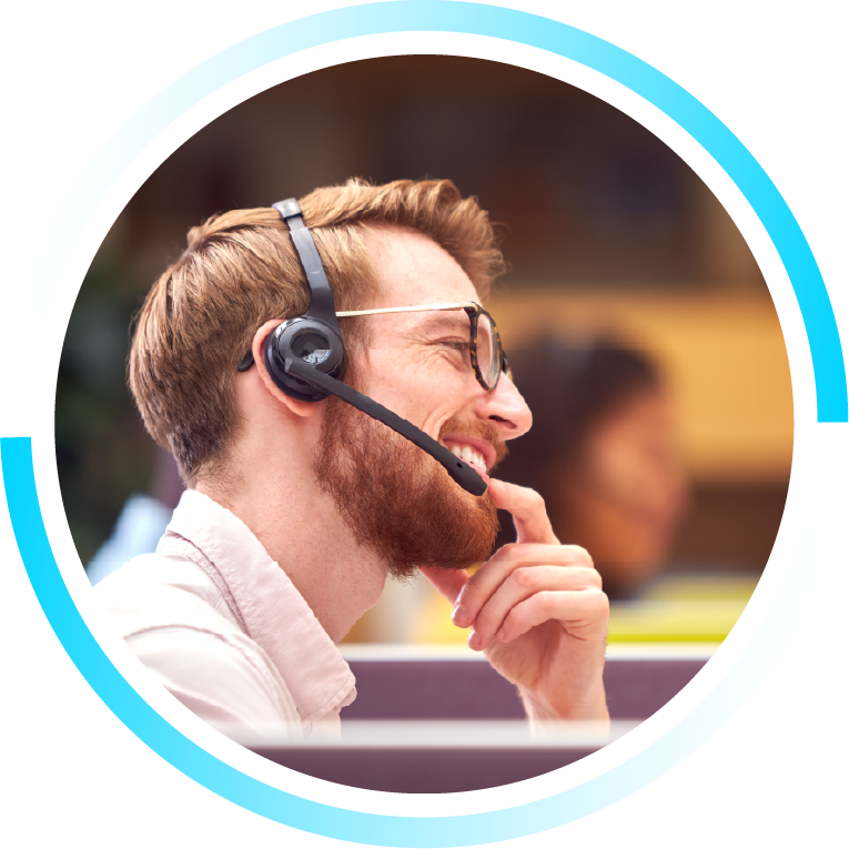 A circle image of a man talking on a phone with a headset in a call centre