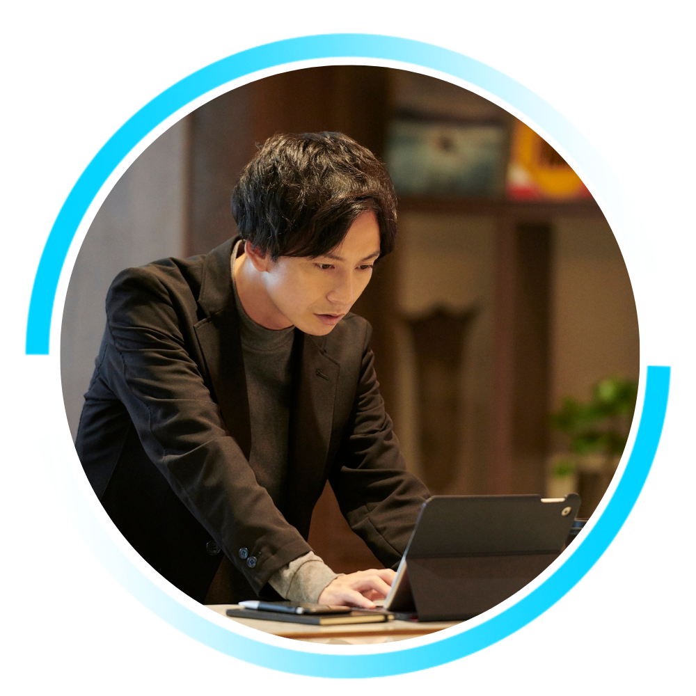 Business professional working on a laptop in a modern office, representing reliable connectivity and hands-on service from iTel Networks.